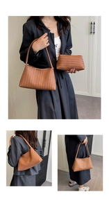Detail view of woven leather shoulder bag set in caramel brown with matching pouch