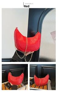 Detail view of a red woven crescent bag with high-end texture and a gold chain strap