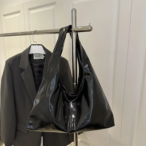 Minimalist black patent leather hobo bag with large capacity and glossy finish