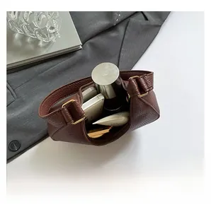 Top view showing the spacious interior of the brown lychee leather hobo bag