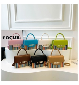 Detail view of multi-color patchwork handbags with colorful woven textures and metal buckles