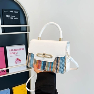 Woven crossbody bag with white leather flap and golden clasp for summer vacation