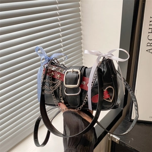 Punk black PU shoulder bag with silver heart ring, star rivets, and bow ribbon details
