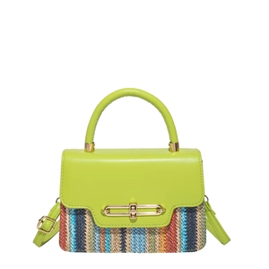 Green leather and multi-color woven straw crossbody bag with gold buckle on white background