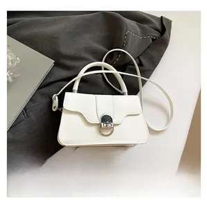 White PU leather bag with circular metal buckle shown next to a phone for size reference