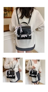 Three-way view of a black Lolita style crossbody bag with white lace and heart accents