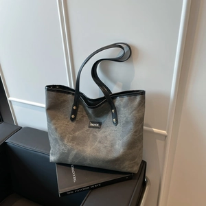Retro washed grey tote bag with leather handles and fashion label for daily commute