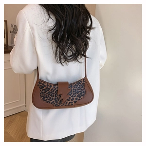 Stylish leopard print patchwork underarm shoulder bag for women in a white blazer