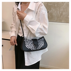 Detailed close-up of a stylish leopard print patchwork underarm shoulder bag for women