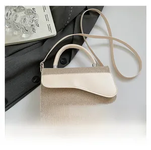 Detail of cream sequin patchwork shoulder bag with unique asymmetrical flap and handle