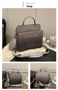 Macro view of gradient grey and purple faux leather bag with metal brand lettering