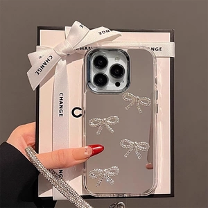 Detail of mirror iPhone case with rhinestone bows and luxury crossbody diamond strap