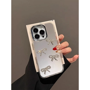 Mirror iPhone case with silver rhinestone bowknots and luxury metallic finish