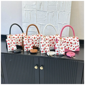 Four sets of vintage crossbody bags with strawberry prints and matching small pouches