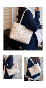 Detail view of large white tote bag with brown bear prints and adjustable shoulder straps