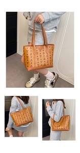 Detail view of large brown tote bag with bear pattern and Creative Cat logo branding