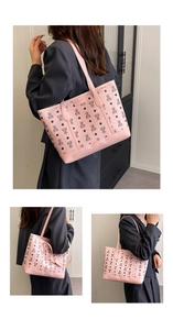 Detail of pink tote bag with bear pattern and Creative Cat logo for daily commute