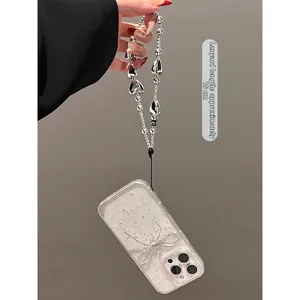 Transparent glitter phone case with silver bow and 15cm metallic beaded hand strap
