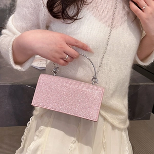 Sparkling pink rhinestone evening clutch bag with silver metal handle and chain strap