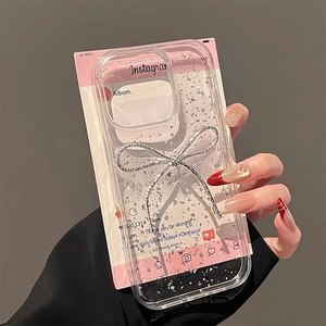 Macro shot of silver bow decoration and foil glitter on transparent iPhone case