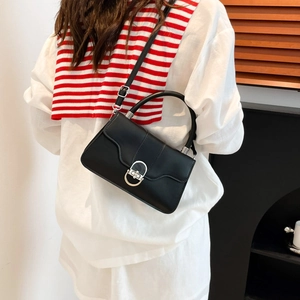 Minimalist black faux leather shoulder bag with silver hardware and adjustable strap