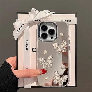 Macro shot of mirror-finish iPhone case with 3D rhinestone butterflies and pearls