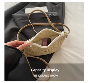 Internal view of beige woven straw crossbody bag showing lipstick and makeup storage