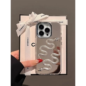 Close-up of mirror silver phone case with 3D metal snake detail and gift box setup