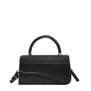 Elegant black saddle-shaped handbag in glitter fabric and matte leather with silver buckle