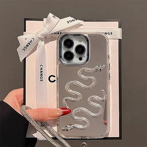 Close-up of mirror silver iPhone case with 3D snake motifs and rhinestone chain