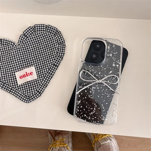 Glittering clear iPhone case with silver bow accent and sparkling sequins finish