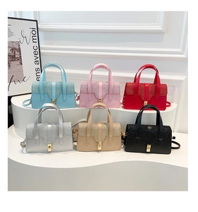 Selection of elegant crossbody handbags in multiple colors with glitter flap detail