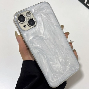 Close-up of white pearlescent texture and camera protection on iPhone soft case