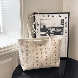Large capacity cream tote bag with brown bear print and shoulder straps for daily use