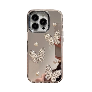 Mirror iPhone case with 3D crystal butterfly and pearl accents on white background