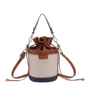 Retro canvas and leather bucket bag with contrast trim and adjustable shoulder strap