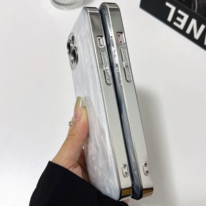Detail of white marble iPhone case with electroplated silver edges and side button cutouts