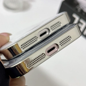 Close-up of precise speaker and charging port cutouts on metallic iPhone case