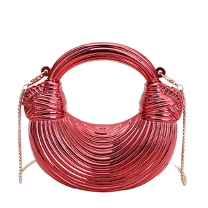 Metallic red dumpling handbag with ruched texture and gold acrylic chain strap