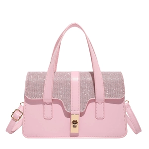 Pink crossbody bag with sparkling rhinestone top flap and golden square clasp closure