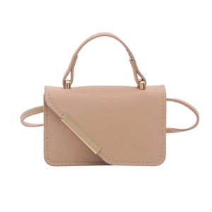 Front view of a nude pink crossbody bag with gold metal trim and top handle