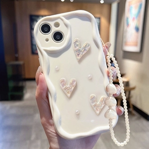 Creamy wave iPhone case with laser hearts and a decorative pearl bracelet strap