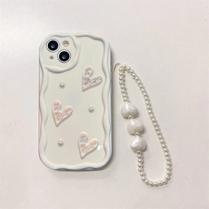 Detail of white wavy phone case with 3D hearts and matching pearl wrist strap
