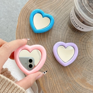 Handheld heart-shaped mini makeup mirrors in pink, blue and purple candy colors