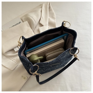 Top view of spacious tweed tote bag interior showing large capacity for essentials
