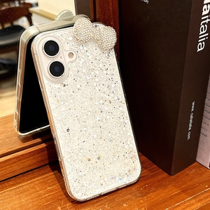 Close-up of sparkling glitter phone case for iPhone featuring a large 3D rhinestone bow