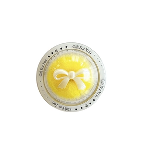 Clear circular phone grip with yellow plush pompom and white 3D ribbon bow gift box