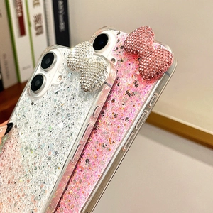 Detail view of sparkly glitter iPhone case with 3D rhinestone bowknot and crystal finish