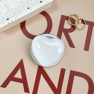Glossy white heart magnetic phone socket stand on an aesthetic Korean ins style background