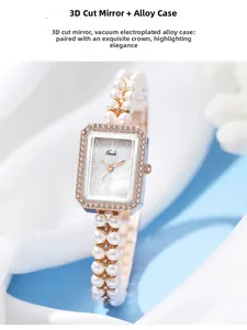 Detail of luxury women's quartz watch with shell dial and pearl strap in rose gold case